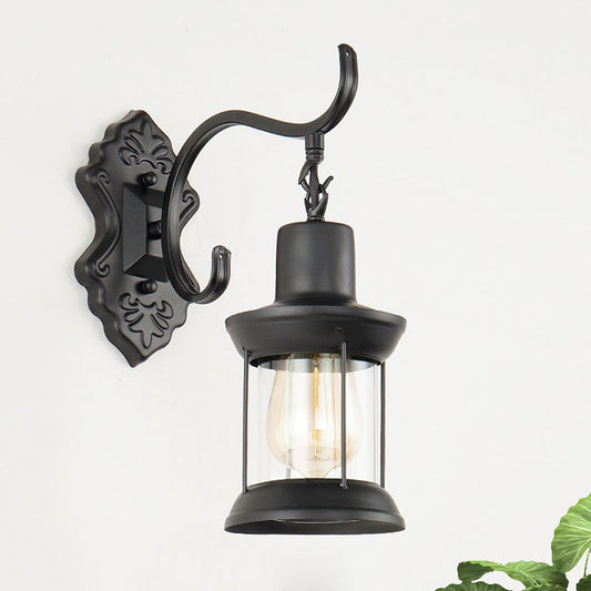 Lantern Clear Glass Wall Mounted Lamp Vintage Single Bulb Outdoor Sconce Light in Black with Carved Pattern Clearhalo 'Art deco wall lights' 'Cast Iron' 'Glass' 'Industrial wall lights' 'Industrial' 'Middle century wall lights' 'Modern' 'Rustic wall lights' 'Tiffany' 'Traditional wall lights' 'Wall Lamps & Sconces' 'Wall Lights' Lighting' 1416372