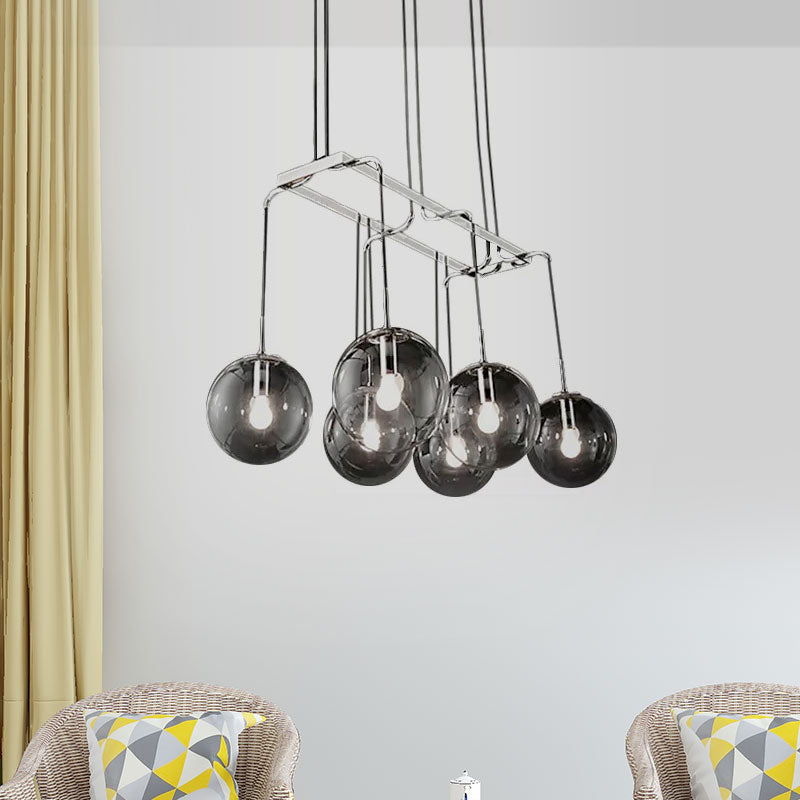 Black Ball Multi Pendant Industrial Clear Closed Glass 6-Light Indoor Hanging Ceiling Light with Linear Canopy Clearhalo 'Ceiling Lights' 'Glass shade' 'Glass' 'Industrial Pendants' 'Industrial' 'Middle Century Pendants' 'Pendant Lights' 'Pendants' 'Tiffany' Lighting' 1417180