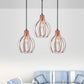 Metallic Rose Gold Pendant Lighting Global Cage Shade 3 Lights Industrial Style Ceiling Light Fixture with Round/Linear Canopy Clearhalo 'Ceiling Lights' 'Modern Pendants' 'Modern' 'Pendant Lights' 'Pendants' Lighting' 1417252