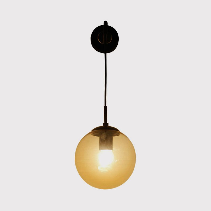 1 Light Globe Sconce Light Fixture Industrial Amber Glass Wall Lamp in Black/Brass for Living Room Clearhalo 'Art deco wall lights' 'Cast Iron' 'Glass' 'Industrial wall lights' 'Industrial' 'Middle century wall lights' 'Modern' 'Rustic wall lights' 'Tiffany' 'Traditional wall lights' 'Wall Lamps & Sconces' 'Wall Lights' Lighting' 1420594