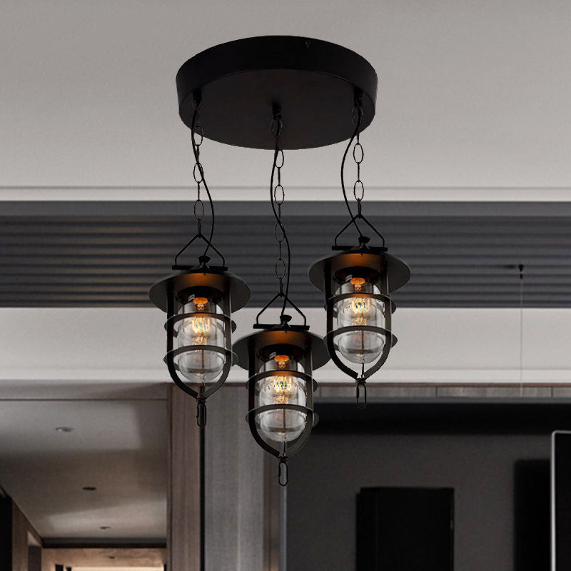 Caged Clear Glass Multi Pendant Vintage 3-Light Living Room Hanging Light Fixture in Black with Round Canopy Clearhalo 'Ceiling Lights' 'Glass shade' 'Glass' 'Industrial Pendants' 'Industrial' 'Middle Century Pendants' 'Pendant Lights' 'Pendants' 'Tiffany' Lighting' 1420736