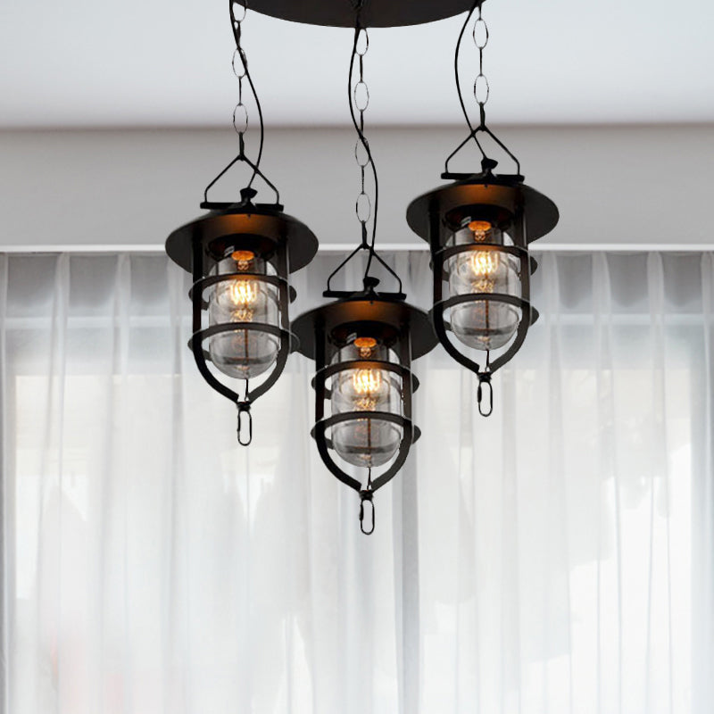 Caged Clear Glass Multi Pendant Vintage 3-Light Living Room Hanging Light Fixture in Black with Round Canopy Clearhalo 'Ceiling Lights' 'Glass shade' 'Glass' 'Industrial Pendants' 'Industrial' 'Middle Century Pendants' 'Pendant Lights' 'Pendants' 'Tiffany' Lighting' 1420737