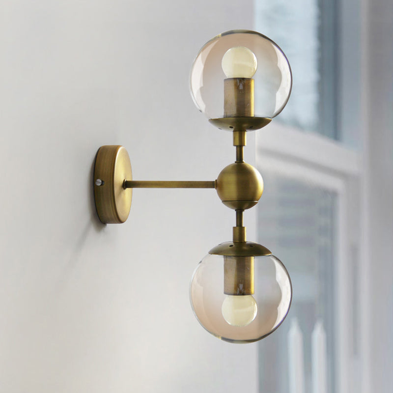 1/2-Head Global Wall Mount Light with Amber Glass Shade Modernist Wall Sconce Lighting in Gold for Bedroom Clearhalo 'Cast Iron' 'Glass' 'Industrial' 'Modern wall lights' 'Modern' 'Tiffany' 'Traditional wall lights' 'Vanity Lights' 'Wall Lights' Lighting' 1433592