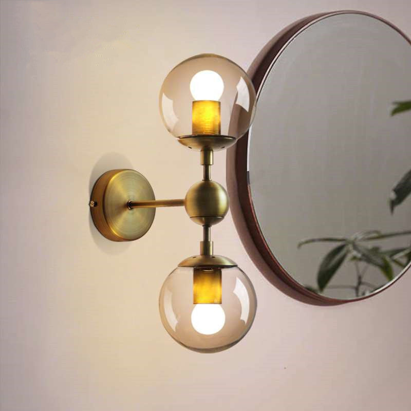 1/2-Head Global Wall Mount Light with Amber Glass Shade Modernist Wall Sconce Lighting in Gold for Bedroom Clearhalo 'Cast Iron' 'Glass' 'Industrial' 'Modern wall lights' 'Modern' 'Tiffany' 'Traditional wall lights' 'Vanity Lights' 'Wall Lights' Lighting' 1433593