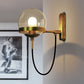 Black/Gold Globe Wall Lighting Modern Clear/Frosted Glass 1 Light Living Room Sconce Light Fixture Clearhalo 'Art deco wall lights' 'Cast Iron' 'Glass' 'Industrial wall lights' 'Industrial' 'Middle century wall lights' 'Modern' 'Rustic wall lights' 'Tiffany' 'Traditional wall lights' 'Wall Lamps & Sconces' 'Wall Lights' Lighting' 143599