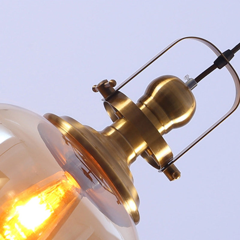 Brass Orb Pendant Ceiling Light Industrial Amber Glass 1 Light Living Room Hanging Lamp for Living Room Clearhalo 'Ceiling Lights' 'Glass shade' 'Glass' 'Industrial Pendants' 'Industrial' 'Middle Century Pendants' 'Pendant Lights' 'Pendants' 'Tiffany' Lighting' 143862
