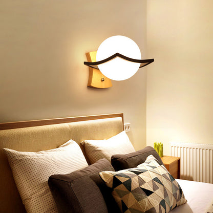 Contemporary Globe Shade Sconce Light 1 Head Milk Glass Wall Lamp in White for Bedside Black Clearhalo 'Modern wall lights' 'Modern' 'Wall Lamps & Sconces' 'Wall Lights' Lighting' 145098