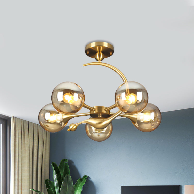 Burst Semi Flush Chandelier Postmodern Amber Glass Orb 3/5 Heads Brass Ceiling Mounted Light with Curved Arm over Table