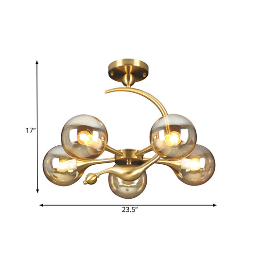 Burst Semi Flush Chandelier Postmodern Amber Glass Orb 3/5 Heads Brass Ceiling Mounted Light with Curved Arm over Table Clearhalo 'Ceiling Lights' 'Close To Ceiling Lights' 'Close to ceiling' 'Glass shade' 'Glass' 'Semi-flushmount' Lighting' 1454841
