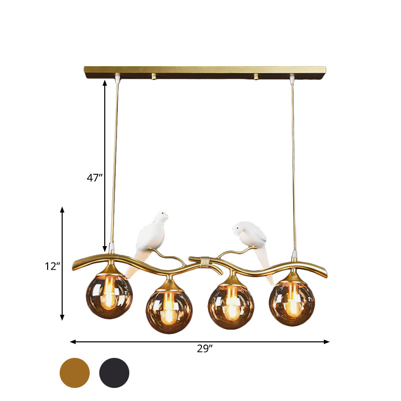Sprig Island Pendant Light Postmodern Iron 4-Light Black/Gold Hanging Lamp with Amber Ball Glass Shade and Bird Deco Clearhalo 'Ceiling Lights' 'Glass shade' 'Glass' 'Island Lights' Lighting' 1456067
