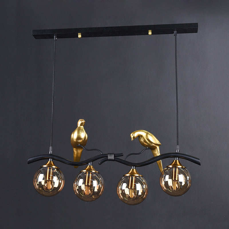 Sprig Island Pendant Light Postmodern Iron 4-Light Black/Gold Hanging Lamp with Amber Ball Glass Shade and Bird Deco Clearhalo 'Ceiling Lights' 'Glass shade' 'Glass' 'Island Lights' Lighting' 1456071