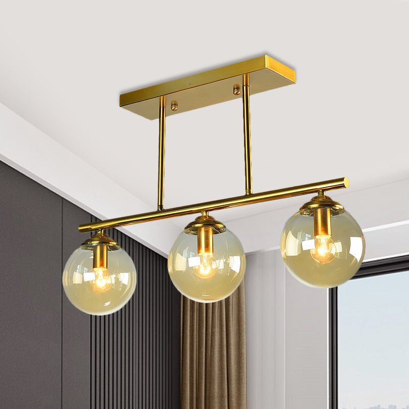 Sphere Clear/Amber Glass Pendant Lamp Vintage 3 Bulbs Gold Hanging Light Fixture over Island Amber Clearhalo 'Ceiling Lights' 'Glass shade' 'Glass' 'Island Lights' 'Pendant Lights' Lighting' 1456072