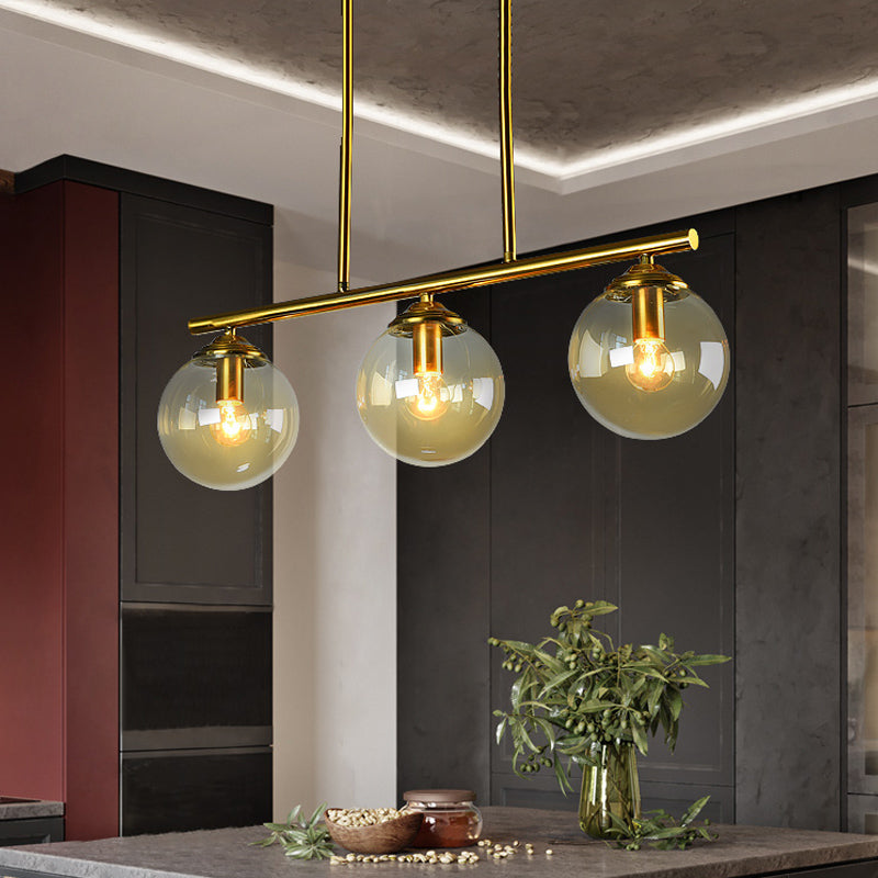 Sphere Clear/Amber Glass Pendant Lamp Vintage 3 Bulbs Gold Hanging Light Fixture over Island Clearhalo 'Ceiling Lights' 'Glass shade' 'Glass' 'Island Lights' 'Pendant Lights' Lighting' 1456073