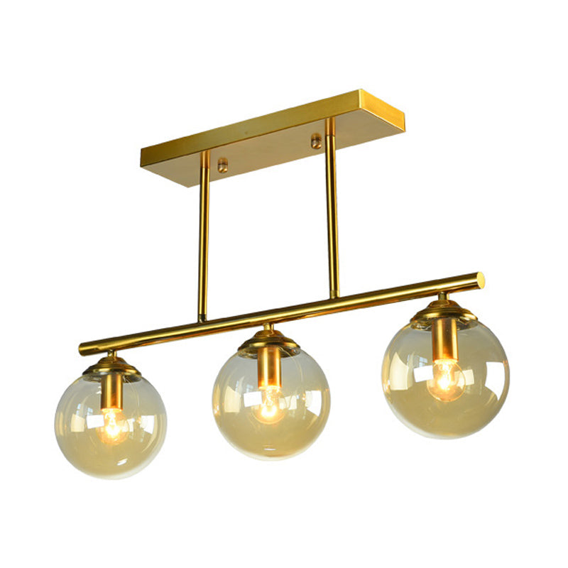 Sphere Clear/Amber Glass Pendant Lamp Vintage 3 Bulbs Gold Hanging Light Fixture over Island Clearhalo 'Ceiling Lights' 'Glass shade' 'Glass' 'Island Lights' 'Pendant Lights' Lighting' 1456075
