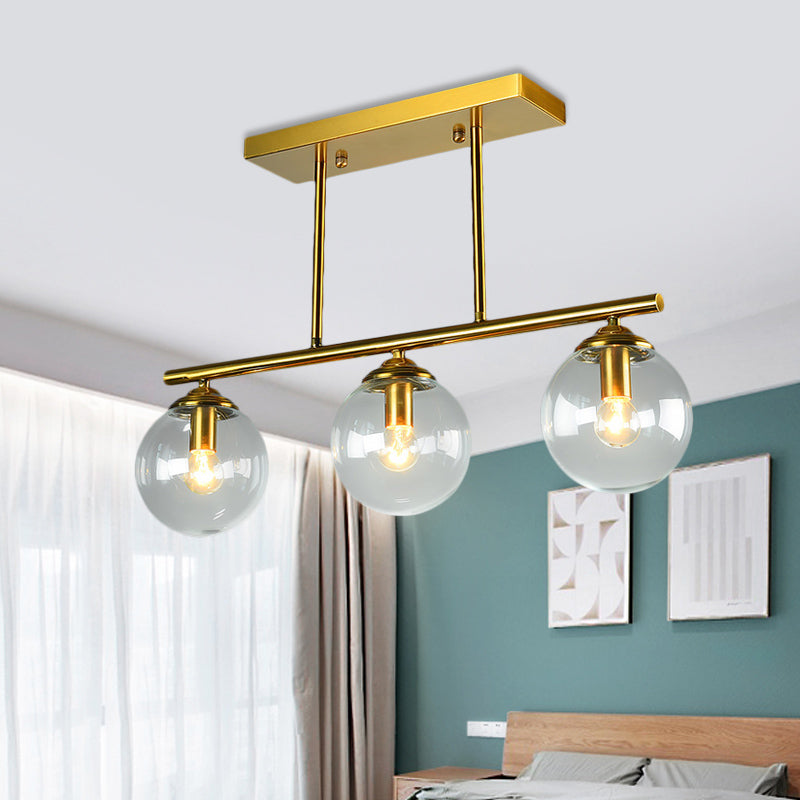 Sphere Clear/Amber Glass Pendant Lamp Vintage 3 Bulbs Gold Hanging Light Fixture over Island Clearhalo 'Ceiling Lights' 'Glass shade' 'Glass' 'Island Lights' 'Pendant Lights' Lighting' 1456078
