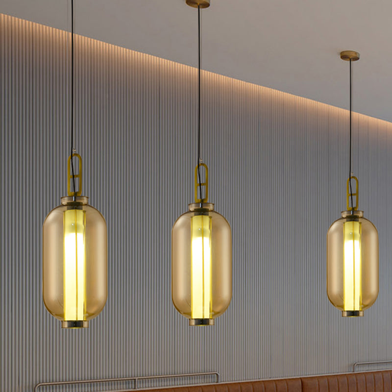 12.5"/19" H Gold Single Pendulum Light Retro Amber Glass Sphere/Ellipse/Oblong Suspension Lamp with Tube Frame Insert Clearhalo 'Ceiling Lights' 'Glass shade' 'Glass' 'Industrial Pendants' 'Industrial' 'Middle Century Pendants' 'Pendant Lights' 'Pendants' 'Tiffany' Lighting' 1457906