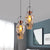 Gold Conical Multi Light Pendant Industrial Amber Glass 2/3 Heads Dining Room Ceiling Lamp with Maple Leaf Pattern 2 Gold Clearhalo 'Ceiling Lights' 'Close To Ceiling Lights' 'Glass shade' 'Glass' 'Industrial Pendants' 'Industrial' 'Middle Century Pendants' 'Pendant Lights' 'Pendants' 'Tiffany' Lighting' 1460234