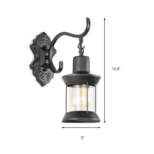 Lantern Clear Glass Wall Mounted Lamp Vintage Single Bulb Outdoor Sconce Light in Black with Carved Pattern Clearhalo 'Art deco wall lights' 'Cast Iron' 'Glass' 'Industrial wall lights' 'Industrial' 'Middle century wall lights' 'Modern' 'Rustic wall lights' 'Tiffany' 'Traditional wall lights' 'Wall Lamps & Sconces' 'Wall Lights' Lighting' 146920