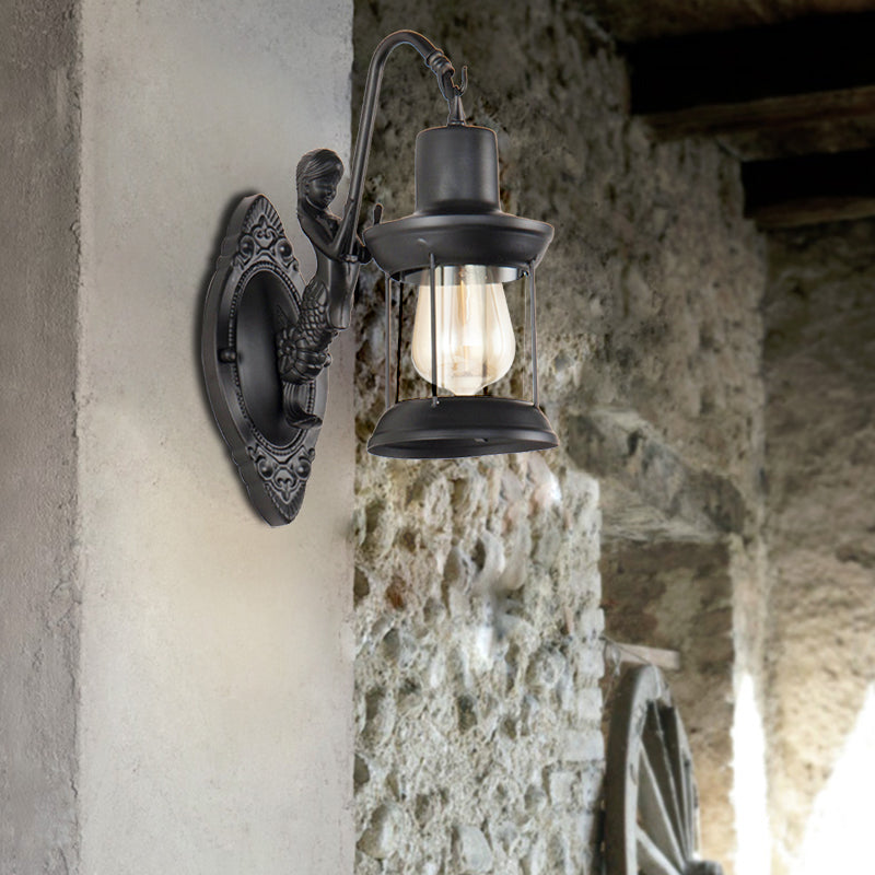 1 Light Clear Glass Wall Sconce Light Industrial Black Lantern Outdoor Lighting Fixture with Mermaid Decoration Black Clearhalo 'Art deco wall lights' 'Cast Iron' 'Glass' 'Industrial wall lights' 'Industrial' 'Middle century wall lights' 'Modern' 'Rustic wall lights' 'Tiffany' 'Traditional wall lights' 'Wall Lamps & Sconces' 'Wall Lights' Lighting' 146937