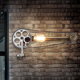 Iron Gear Bike Wall Lamp Warehouse 1 Light Restaurant Wall Mounted Light in Bronze with Pipe Arm Bronze Clearhalo 'Cast Iron' 'Glass' 'Industrial wall lights' 'Industrial' 'Middle century wall lights' 'Modern' 'Rustic wall lights' 'Tiffany' 'Traditional wall lights' 'Wall Lamps & Sconces' 'Wall Lights' Lighting' 1472694_4fd61431-e807-4581-b2cd-8ef7711e7a39