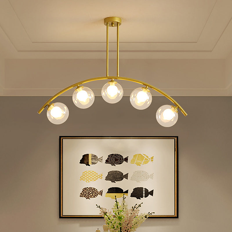 White/Clear Glass Orb Island Lamp Modernist 5 Bulbs Pendant Lighting with Brass Arch Arm for Dining Room Clear Clearhalo 'Ceiling Lights' 'Chandeliers' 'Close To Ceiling Lights' 'Glass shade' 'Glass' 'Island Lights' Lighting' 1476086