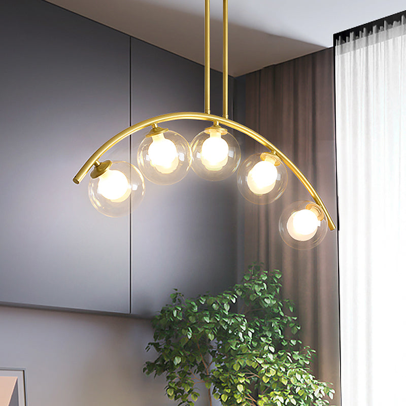 White/Clear Glass Orb Island Lamp Modernist 5 Bulbs Pendant Lighting with Brass Arch Arm for Dining Room Clearhalo 'Ceiling Lights' 'Chandeliers' 'Close To Ceiling Lights' 'Glass shade' 'Glass' 'Island Lights' Lighting' 1476087