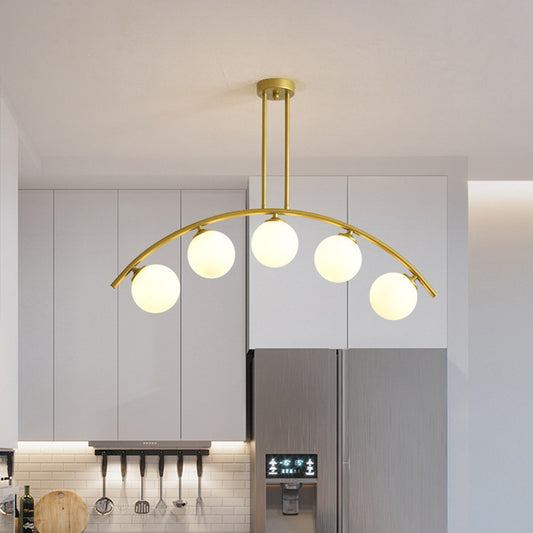 White/Clear Glass Orb Island Lamp Modernist 5 Bulbs Pendant Lighting with Brass Arch Arm for Dining Room White Clearhalo 'Ceiling Lights' 'Chandeliers' 'Close To Ceiling Lights' 'Glass shade' 'Glass' 'Island Lights' Lighting' 1476091