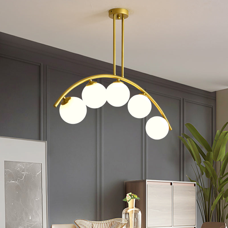 White/Clear Glass Orb Island Lamp Modernist 5 Bulbs Pendant Lighting with Brass Arch Arm for Dining Room Clearhalo 'Ceiling Lights' 'Chandeliers' 'Close To Ceiling Lights' 'Glass shade' 'Glass' 'Island Lights' Lighting' 1476092