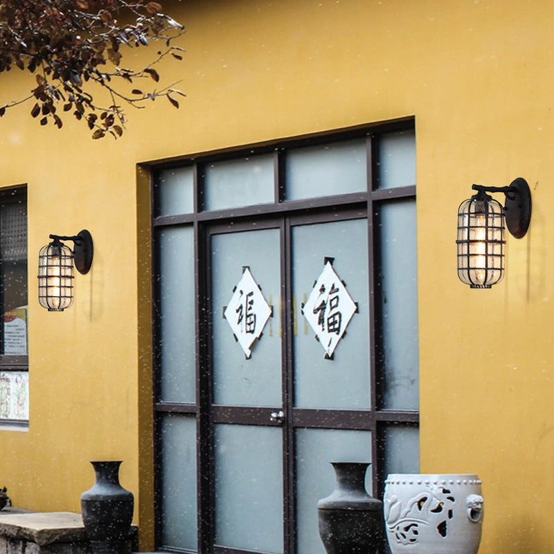 Caged Seedy Glass Wall Mounted Lamp Industrial Single Bulb Outdoor Sconce Light in Black/Bronze, 5.5"/6"/8" Wide Black Clearhalo 'Art deco wall lights' 'Cast Iron' 'Glass' 'Industrial wall lights' 'Industrial' 'Middle century wall lights' 'Modern' 'Rustic wall lights' 'Tiffany' 'Traditional wall lights' 'Wall Lamps & Sconces' 'Wall Lights' Lighting' 149934