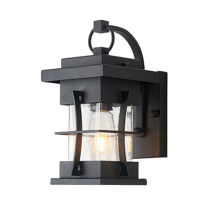 Clear Glass Black Sconce Light Square/Rectangle 1-Light Coastal Wall Lamp Fixture with Iron Cage Clearhalo 'Art deco wall lights' 'Cast Iron' 'Glass' 'Industrial wall lights' 'Industrial' 'Middle century wall lights' 'Modern' 'Rustic wall lights' 'Tiffany' 'Traditional wall lights' 'Wall Lamps & Sconces' 'Wall Lights' Lighting' 149967