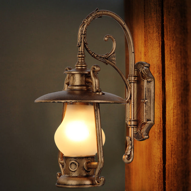 Lantern Frosted Glass Wall Mounted Lamp Coastal Single Bulb Outdoor Sconce Light in Black/Aged Brass Clearhalo 'Art deco wall lights' 'Cast Iron' 'Glass' 'Industrial wall lights' 'Industrial' 'Middle century wall lights' 'Modern' 'Rustic wall lights' 'Tiffany' 'Traditional wall lights' 'Wall Lamps & Sconces' 'Wall Lights' Lighting' 151007