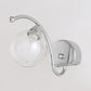 Modern Globe Wall Lamp Clear Glass 1 Light Bedroom Led Wall Light Sconce in Chrome with Curved Arm Clearhalo 'Cast Iron' 'Glass' 'Industrial' 'Modern wall lights' 'Modern' 'Tiffany' 'Traditional wall lights' 'Wall Lamps & Sconces' 'Wall Lights' Lighting' 1523257