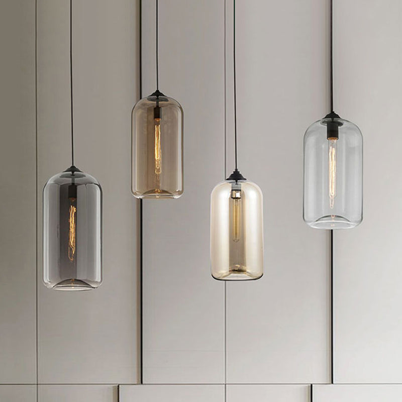 8" Wide Clear/Amber/Smoky Glass Cylindrical Pendant Light Contemporary 1 Light Black Hanging Lamp Fixture Clearhalo 'Ceiling Lights' 'Glass shade' 'Glass' 'Modern Pendants' 'Modern' 'Pendant Lights' 'Pendants' Lighting' 1523666