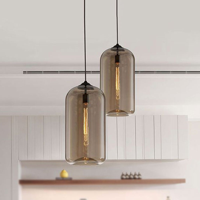 8" Wide Clear/Amber/Smoky Glass Cylindrical Pendant Light Contemporary 1 Light Black Hanging Lamp Fixture Amber 8" Clearhalo 'Ceiling Lights' 'Glass shade' 'Glass' 'Modern Pendants' 'Modern' 'Pendant Lights' 'Pendants' Lighting' 1523668