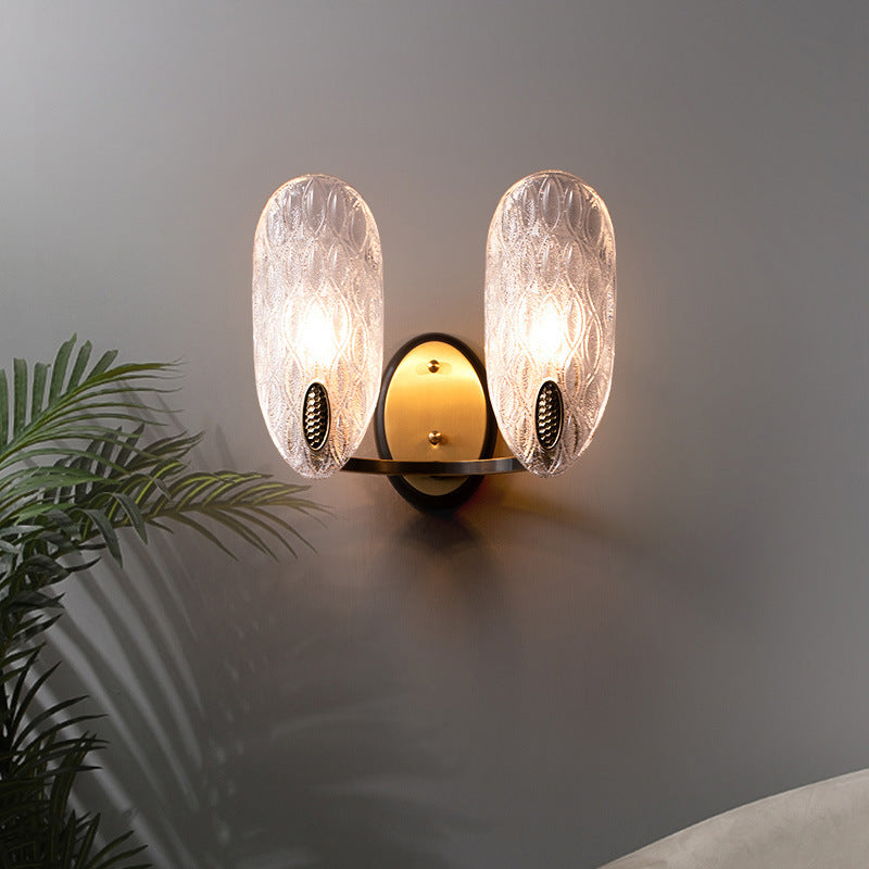 Textured Glass Oval Wall Lamp Modern 1/2-Light Wall Light Fixture in Black and Gold for Corridor Clearhalo 'Art deco wall lights' 'Cast Iron' 'Glass' 'Industrial wall lights' 'Industrial' 'Middle century wall lights' 'Modern' 'Rustic wall lights' 'Tiffany' 'Traditional wall lights' 'Wall Lamps & Sconces' 'Wall Lights' Lighting' 155514