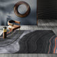 Black and Grey Modern Rug Polyester Swirl Stripe Pattern Rug Washable Non-Slip Backing Carpet for Living Room Clearhalo 'Area Rug' 'Modern' 'Rugs' Rug' 1597682
