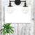 Round Living Room Wall Light Fixture Industrial Clear Glass 2-Light Black/Brass Sconce Lamp for Study Room Black Clearhalo 'Cast Iron' 'Glass' 'Industrial wall lights' 'Industrial' 'Middle century wall lights' 'Modern' 'Tiffany' 'Traditional wall lights' 'Wall Lamps & Sconces' 'Wall Lights' Lighting' 159810