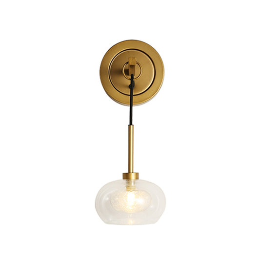 Oval Living Room Wall Light Fixture Industrial Clear Glass 1 Light Brass Sconce Lamp Clearhalo 'Cast Iron' 'Glass' 'Industrial' 'Modern wall lights' 'Modern' 'Tiffany' 'Traditional wall lights' 'Wall Lamps & Sconces' 'Wall Lights' Lighting' 161462
