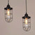 2/3 Bulbs Caged Multiple Lamp Pendant Industrial Black Clear Glass Hanging Light Kit, Linear/Round Canopy 2 Black Linear Clearhalo 'Ceiling Lights' 'Glass shade' 'Glass' 'Industrial Pendants' 'Industrial' 'Middle Century Pendants' 'Pendant Lights' 'Pendants' 'Tiffany' Lighting' 16313