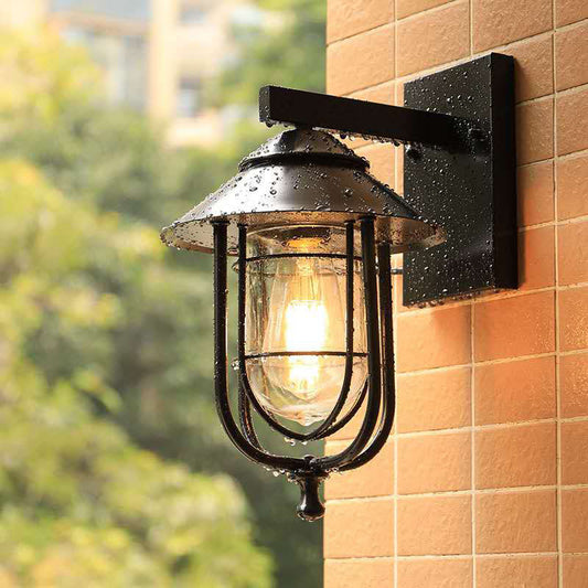Lantern-Like Balcony Wall Sconce Warehouse Metal 1 Head Weathered Copper/Black Wall Lighting Fixture with Oval Clear Glass Shade Black Clearhalo 'Art deco wall lights' 'Cast Iron' 'Glass' 'Industrial wall lights' 'Industrial' 'Middle century wall lights' 'Modern' 'Rustic wall lights' 'Tiffany' 'Traditional wall lights' 'Wall Lamps & Sconces' 'Wall Lights' Lighting' 1637455