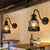 Bottle Cage Metal Wall Mount Light with Gooseneck Arm Industrial 1 Head Bar Wall Sconce Lighting in Black Black Clearhalo 'Art deco wall lights' 'Cast Iron' 'Glass' 'Industrial wall lights' 'Industrial' 'Middle century wall lights' 'Modern' 'Rustic wall lights' 'Tiffany' 'Traditional wall lights' 'Wall Lamps & Sconces' 'Wall Lights' Lighting' 164883