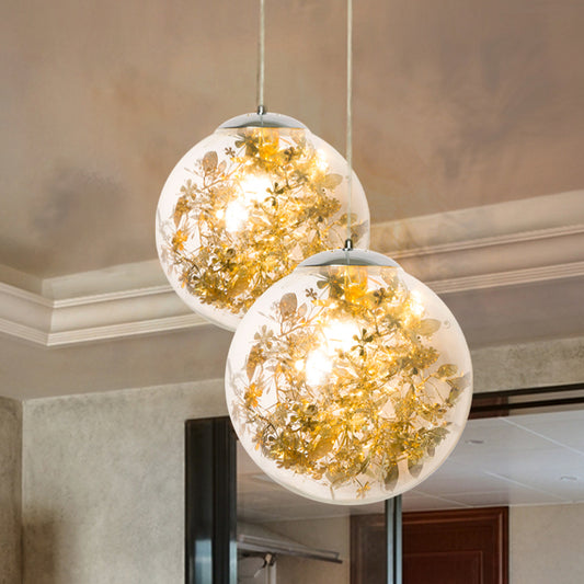 Globe Bedroom Hanging Light Clear Glass 1-Light Modernist Pendant Lighting with Inner Leaf Decor in Silver/Gold Gold Clearhalo 'Ceiling Lights' 'Chandeliers' 'Glass shade' 'Glass' 'Pendant Lights' 'Pendants' Lighting' 1650035