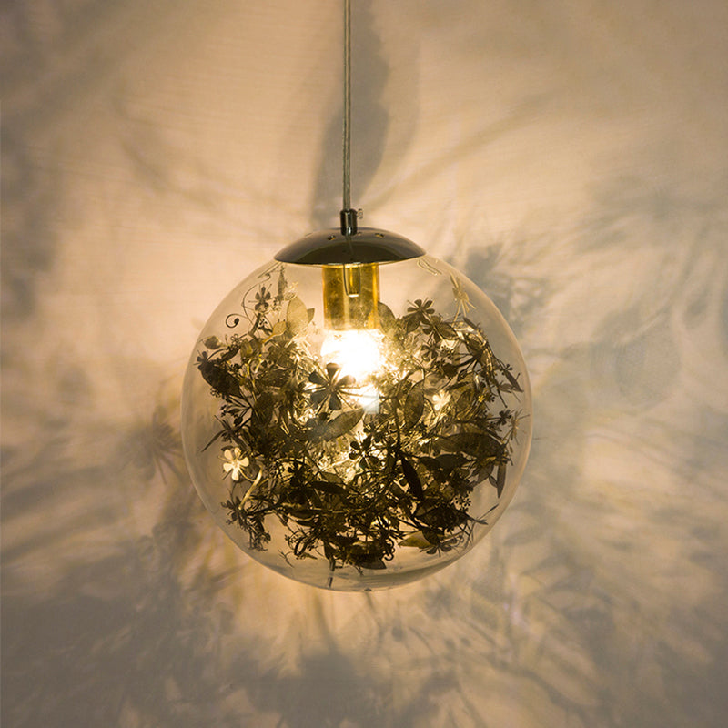 Globe Bedroom Hanging Light Clear Glass 1-Light Modernist Pendant Lighting with Inner Leaf Decor in Silver/Gold Clearhalo 'Ceiling Lights' 'Chandeliers' 'Glass shade' 'Glass' 'Pendant Lights' 'Pendants' Lighting' 1650041