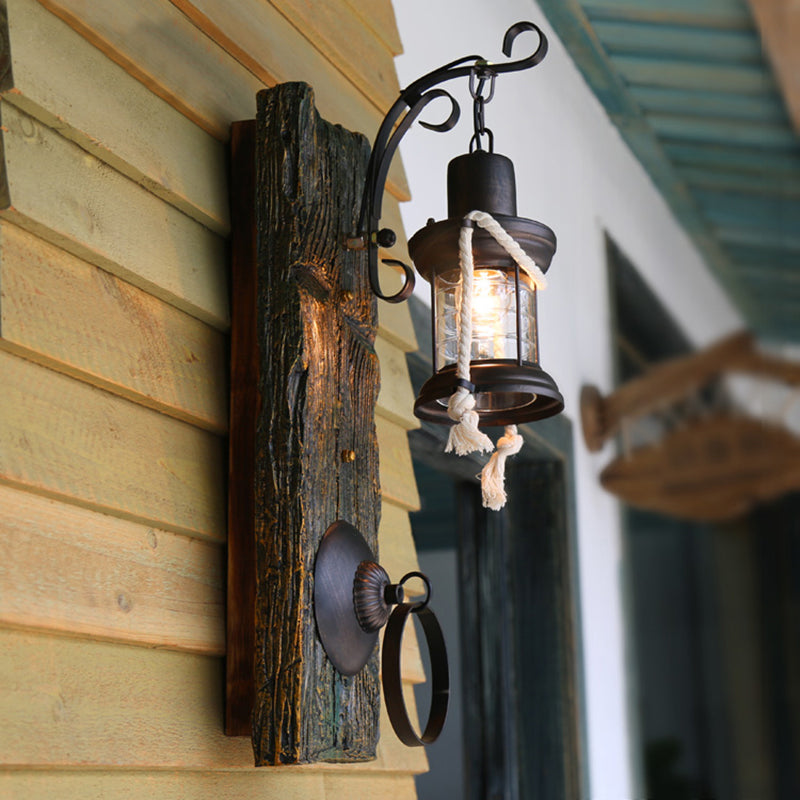 One Bulb Clear Glass Sconce Light Fixture Coastal Black Kerosene Outdoor Wall Lamp with Wooden Backplate Clearhalo 'Industrial wall lights' 'Industrial' 'Middle century wall lights' 'Rustic wall lights' 'Tiffany' 'Wall Lamps & Sconces' 'Wall Lights' Lighting' 165275