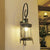 Metal Antique Bronze Wall Mount Lamp Lantern 1 Light Vintage Wall Lighting with Curvy Arm Antique Bronze Clearhalo 'Art deco wall lights' 'Cast Iron' 'Glass' 'Industrial wall lights' 'Industrial' 'Middle century wall lights' 'Modern' 'Rustic wall lights' 'Tiffany' 'Traditional wall lights' 'Wall Lamps & Sconces' 'Wall Lights' Lighting' 1687654