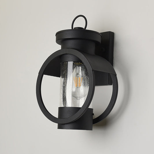 Cylindrical Courtyard Wall Sconce Traditional Seedy Glass 1-Bulb Black Wall Mount Lamp Clearhalo 'Art deco wall lights' 'Cast Iron' 'Glass' 'Industrial wall lights' 'Industrial' 'Middle century wall lights' 'Modern' 'Rustic wall lights' 'Tiffany' 'Traditional wall lights' 'Wall Lamps & Sconces' 'Wall Lights' Lighting' 1687797