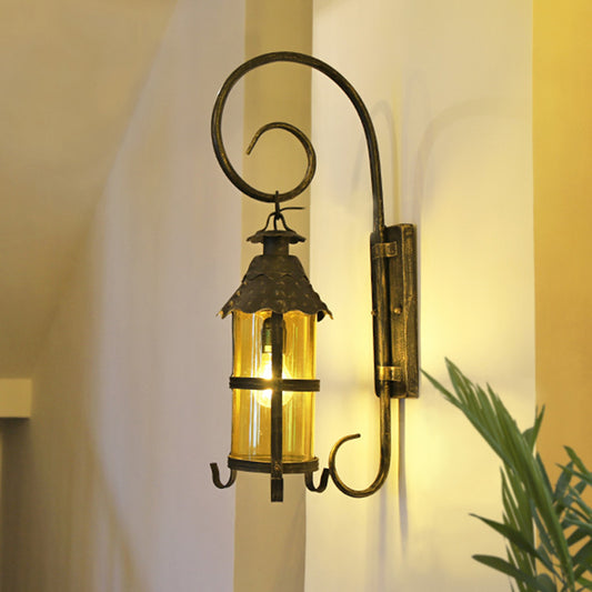 Retro Lantern Wall Mount Lighting 1 Head Metallic Wall Light Fixture with Scroll Arm in Antique Bronze Antique Bronze Clearhalo 'Art deco wall lights' 'Cast Iron' 'Glass' 'Industrial wall lights' 'Industrial' 'Middle century wall lights' 'Modern' 'Rustic wall lights' 'Tiffany' 'Traditional wall lights' 'Wall Lamps & Sconces' 'Wall Lights' Lighting' 1687978