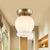 Antique Ridged Bud Semi Mounted Lighting 1 Bulb Cream Glass Ceiling Light Fixture in Brass Brass Clearhalo 'Ceiling Lights' 'Close To Ceiling Lights' 'Close to ceiling' 'Glass shade' 'Glass' 'Semi-flushmount' Lighting' 1688492