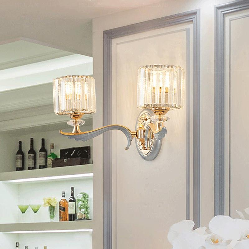 Modernist 1/2-Head Wall Light Fixture Gold Cylinder Wall Mounted Lamp with Clear Crystal Shade Clearhalo 'Modern wall lights' 'Modern' 'Wall Lamps & Sconces' 'Wall Lights' Lighting' 1771318