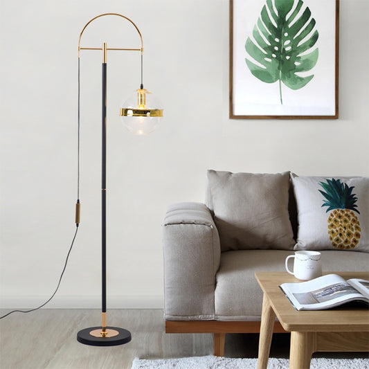 1-Head Living Room Floor Lighting Modern Black and Gold Curved Standing Lamp with Globe Clear Glass Shade in White/Yellow Light Black-Gold Clearhalo 'Floor Lamps' 'Lamps' Lighting' 1781282